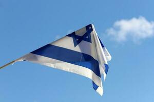 The blue and white flag of Israel with the six-pointed Star of David. photo