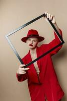 woman with wooden frame posing red suit Lifestyle posing photo