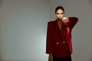 chic woman in red blazer evening makeup brunette costume photo