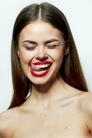 Attractive woman naked shoulders closed eyes red lips tongue touch spa treatments photo