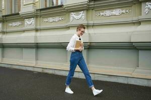 short haired woman on the street near the building rest education photo
