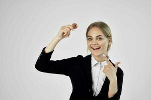 Businesswoman Bitcoin cryptocurrency in hands isolated background photo