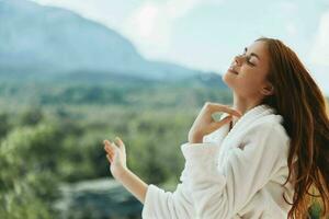 woman looks at a beautiful view from the balcony unaltered photo