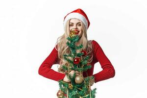 bonito mujer fiesta Navidad decoración Navidad árbol ligero antecedentes foto