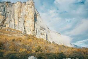 landscape autumn high mountains on blue sky dry grass fresh air photo