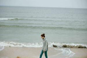 beautiful woman cloudy weather by the sea travel fresh air unaltered photo