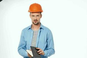 man in construction uniform blueprints builder isolated background photo