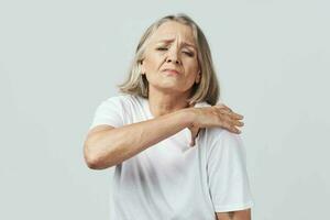 elderly woman joint pain health problems treatment photo