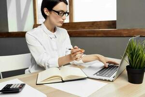 woman in costume in front of laptop documents Professional Job Studio Lifestyle photo