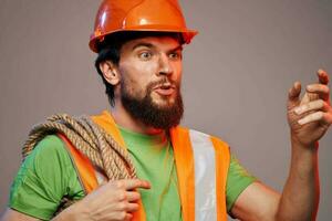 Bearded man in a construction firm orange paint industry photo