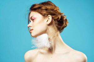 cheerful woman bare shoulders fluffy earrings charm fashion close-up photo
