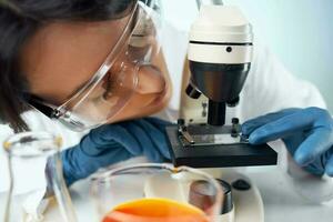 women scientists chemical solutions microscope research experiment photo