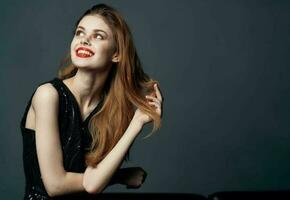 red-haired lady in a black dress gesturing with her hands hugs emotions makeup model photo