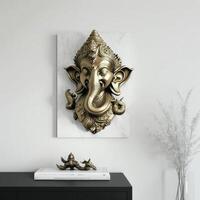 A white walled room with a statue of an Indian mythological God Lord Ganesha as Mural. . photo