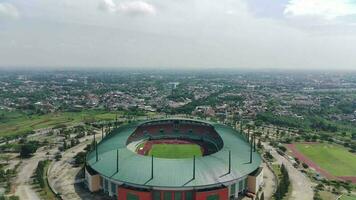 4K footage aerial view of Pakansari stadium on a sunny day located in Bogor, Indonesia. video