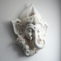 A white walled room with a statue of an Indian mythological God Lord Ganesha as Mural. . photo