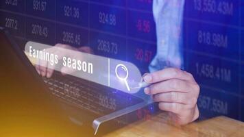 Earnings season Hand touching of written in search bar with the financial data visible in the background,  Reports Stock Market Ticker Words photo