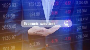 Economic sanctions, written in search bar with the financial data visible in the background. Reports Stock Market Ticker Words photo