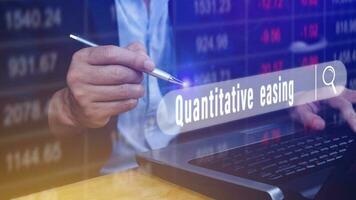 Quantitative easing written in search bar with the financial data visible on background, Quantitative easing concept stock Market online marketing photo