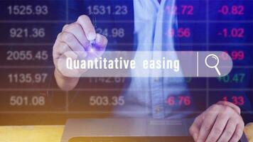 Quantitative easing written in search bar with the financial data visible on background, Quantitative easing concept stock Market online marketing photo