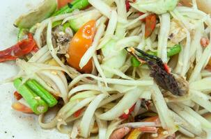 papaya salad on white dish ,Thailand style food photo