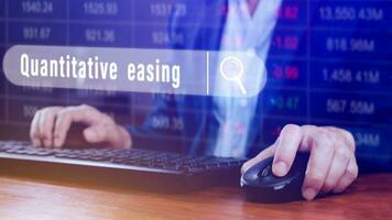 Quantitative easing written in search bar with the financial data visible on background, Quantitative easing concept stock Market online marketing photo