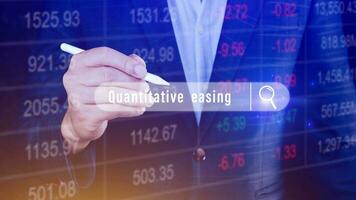 Quantitative easing written in search bar with the financial data visible on background, Quantitative easing concept stock Market online marketing photo