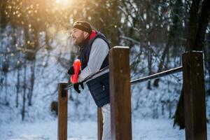 Boxer is training at the park in the winter. He is working on his fitness. photo