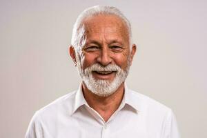 Portrait of a senior man in a white shirt photo