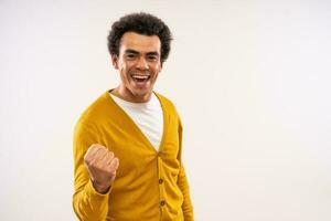 Studio shot portrait of happy smiling multiracial man. Man is looking at camera and smiling. photo