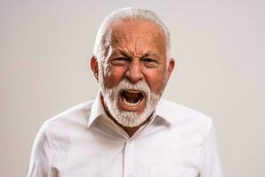 Portrait of a senior man in a white shirt photo