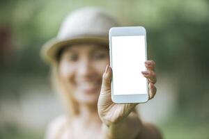 woman hand holding cellphone, smartphone with white screen photo