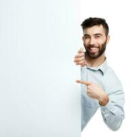 A young bearded man showing blank signboard, isolated over white photo