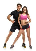 Athletic couple - man and woman with thumb up on the white photo