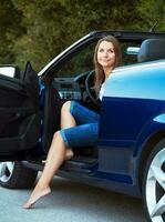 Caucasian woman in a cabriolet photo