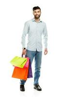 Handsome man holding shopping bags photo