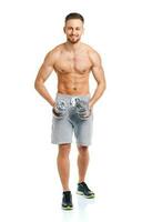 hombre atlético con pesas en el blanco foto