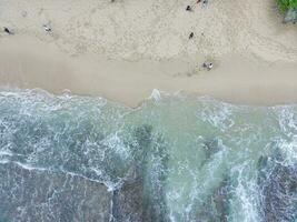 aerial top down view of beautiful sand beach and coral reefs photo