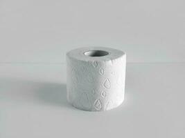 A roll of soft toilet paper on a light background photo