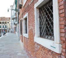 View of the ancient old european street in Italy. Street scene, old wall and window with iron grille. png