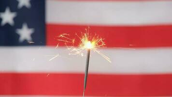 Sparkler against USA flag. Independence Day celebration, fourth of july video