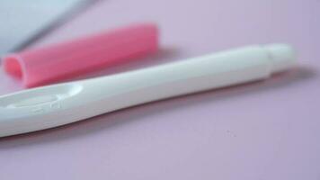 Pregnancy test kit on light purple background video