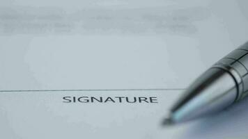 Close up of signature on a contact on table video