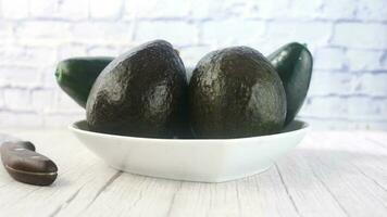 avocado on a plate on wooden table video