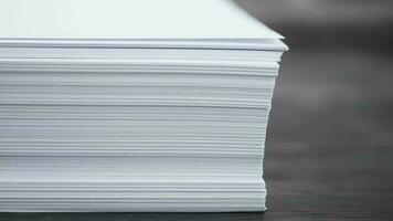 Close up of stack of empty paper on table video