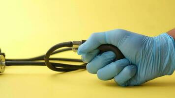 hand in latex gloves using blood pressure machine video