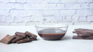 Dark chocolate cream in a bowl on white video