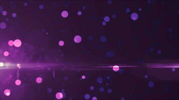 Abstract background of purple luminous particles and bokeh dots of festive energy magic, video 4k, 60 fps