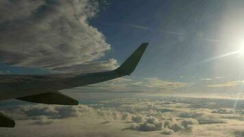 Airliner cruising trough the clouds, view from the airplane porthole. video