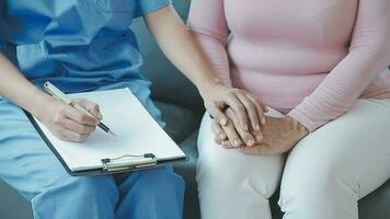 Doctor use stethoscope, checking up heart beat, lunch of auscultation in doctor office at hospital. Patient worker has to get medical checkup every year for her health or medical checkup cardiologist video